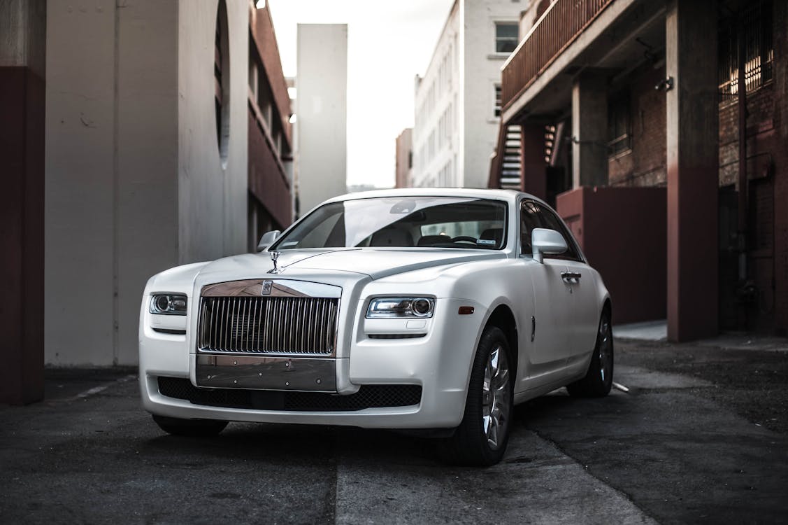 White Rolls-Royce Ghost parked in an urban setting